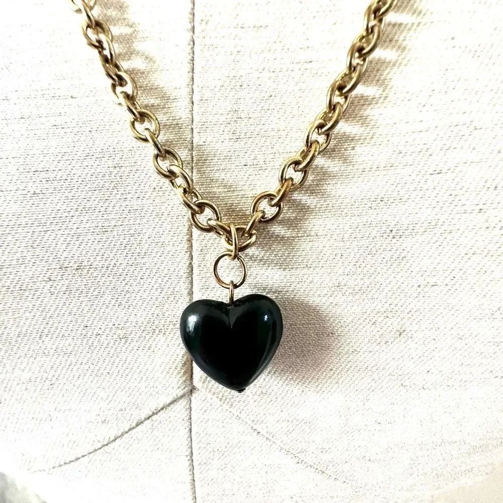 Long gold tone black heart pendant necklace